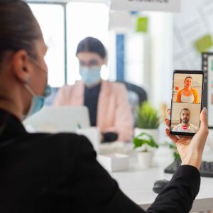 rear-view-people-using-mobile-phone-scaled (1)